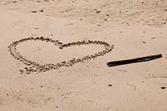 photo of heart drawn in the sand