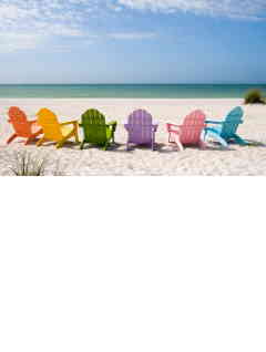 group of colorful chairs on beach